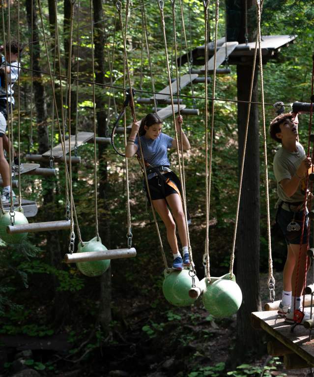 Kids going through an aerial course at Adirondack Extreme