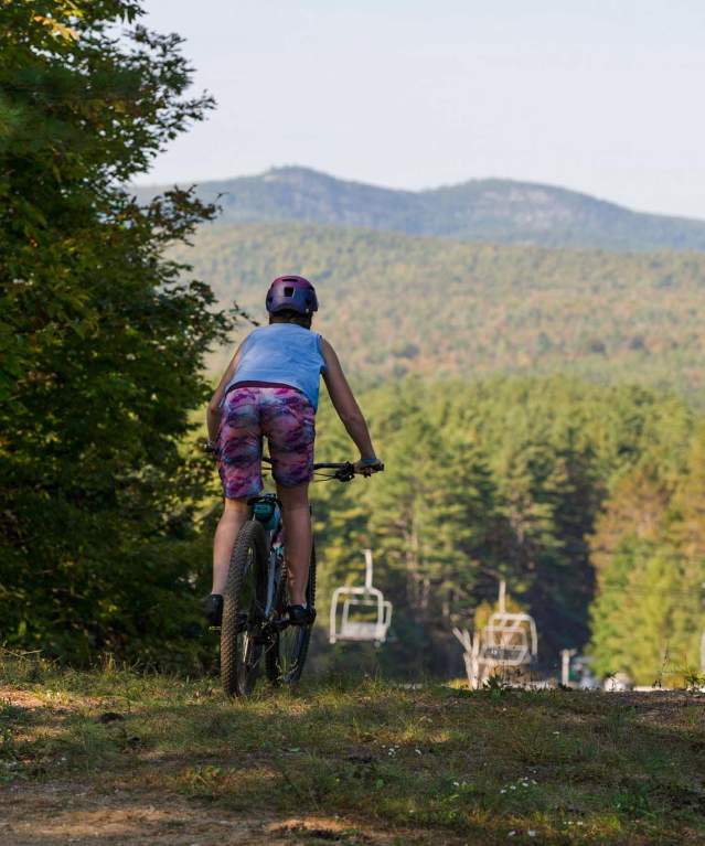 Woman mountain biking on Gore Mountain