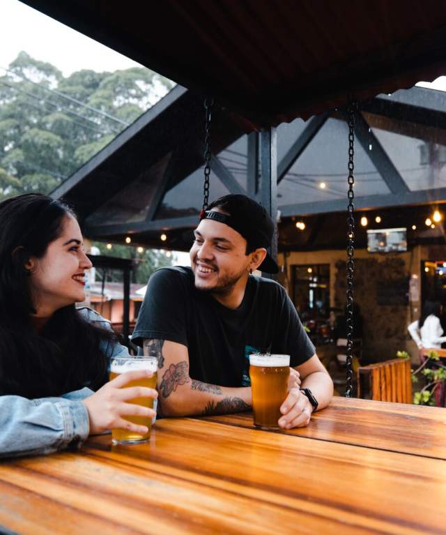 Friends enjoying some beers on the terraces of Boquete Brewing Company at Boquete