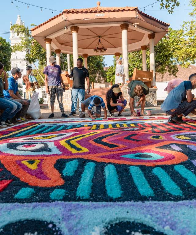 Group working on Corps Christi carpet