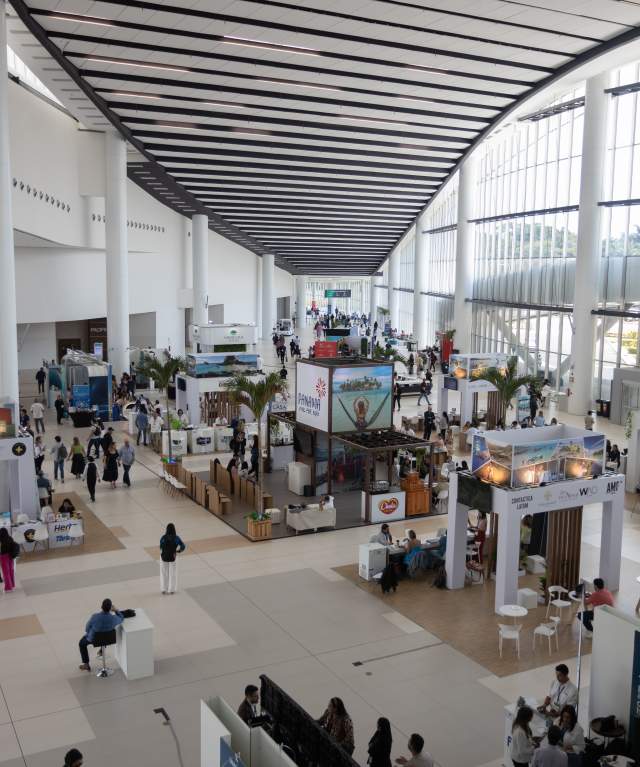 Panama Convention Center, a modern and spacious building with large windows and a sleek design.  It is located on the Amador Causeway, offering stunning views of the Pacific Ocean and the Bridge of the Americas.