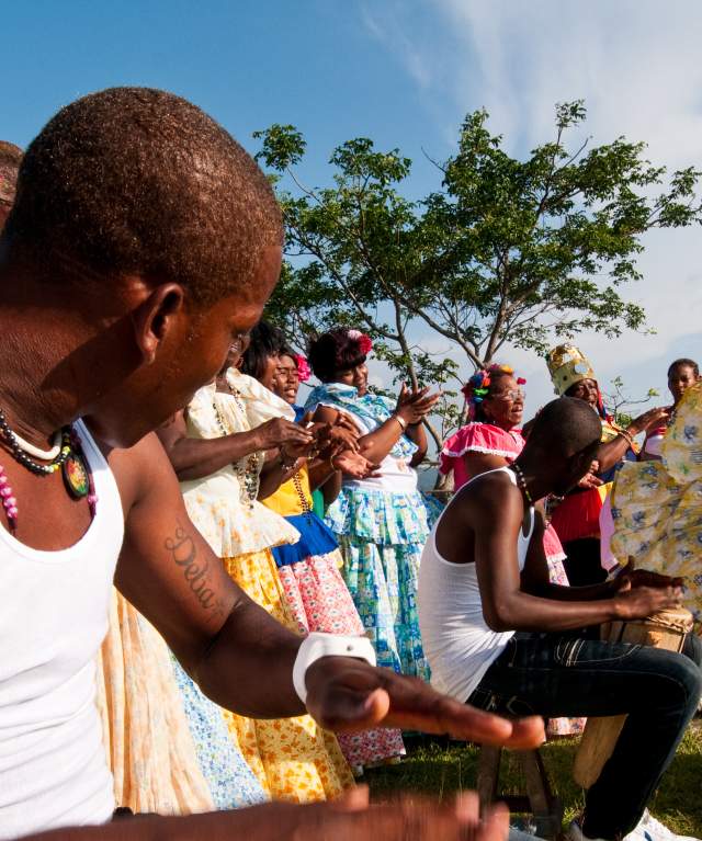 Men playing drums and women performing congo dances  spanish colonial fortress.  Colon province, Panama, Central America.