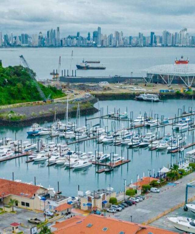 Aerial View of Amador Marina. Restaurants around it. City Skyline in the background.