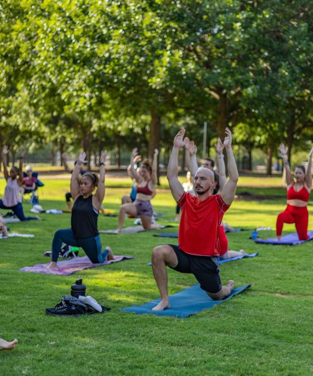 Yoga in the park with instructor