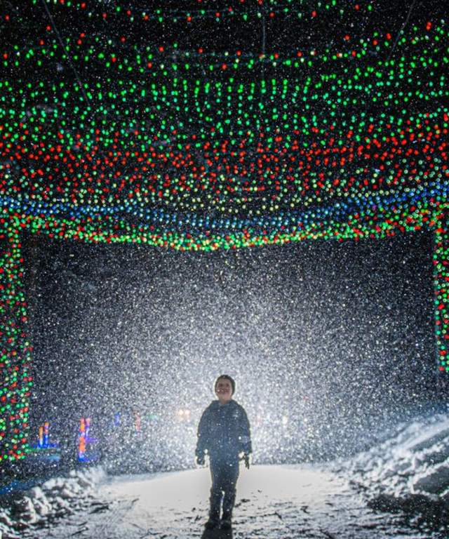 Kid under a tunnel of lights