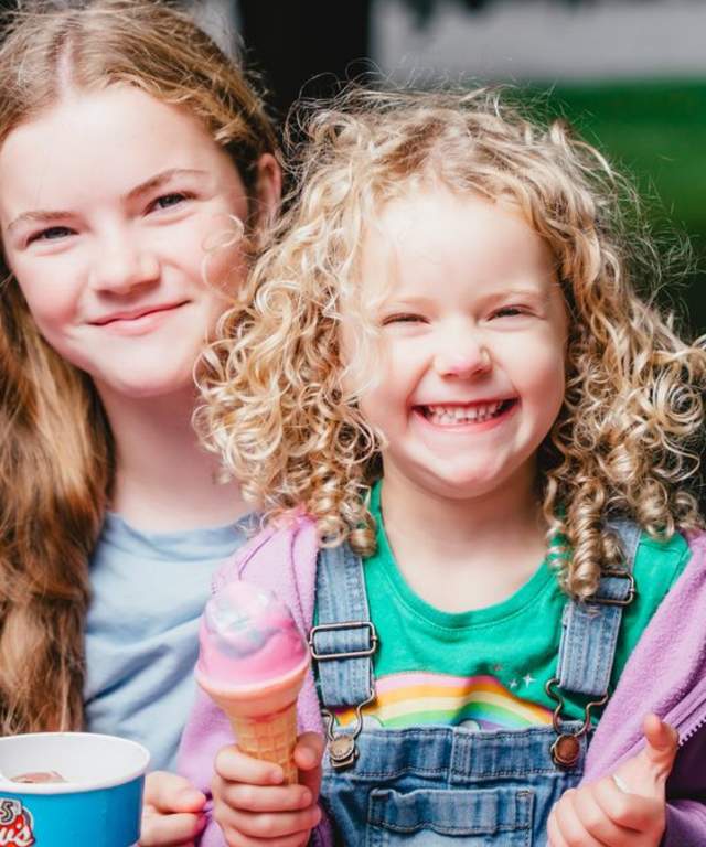 Happy kids eating ice creams