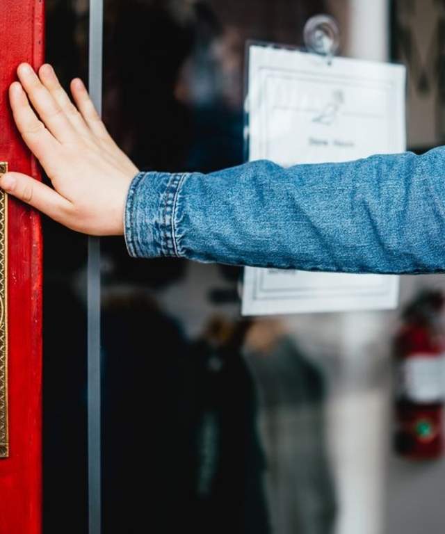 A woman opening a door