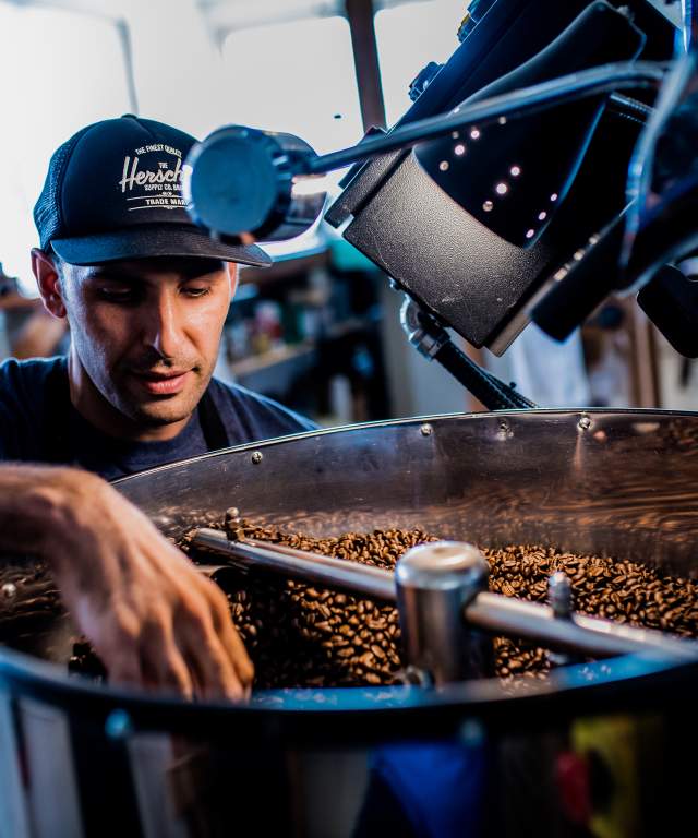 Man roasting coffee