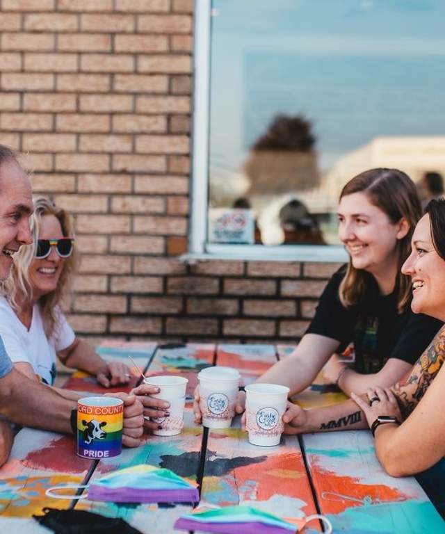 people sitting outside with drinks