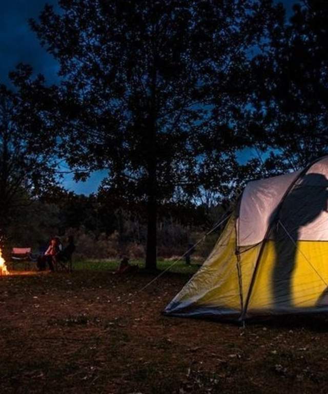 People inside a camping tent