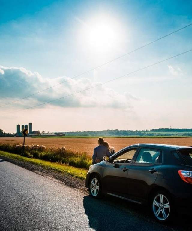 Couple enjoying nature next to the road