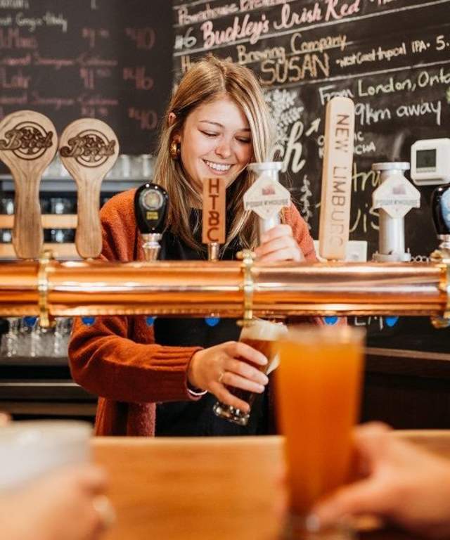 Woman serving beer