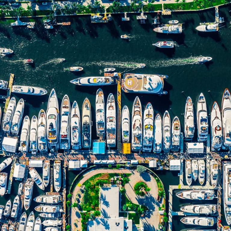 Aerial photo of many yachts moored next to each other