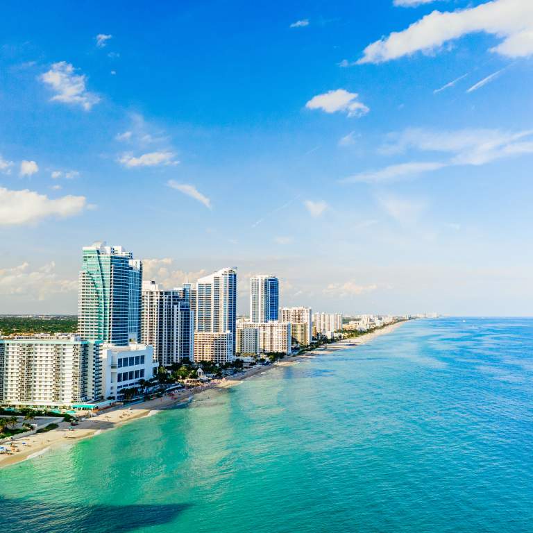 Aerial view of Hallandale Beach and buildings at the shoreline