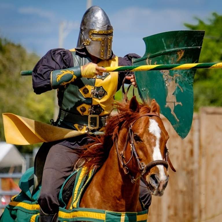 A knight on horseback in a jousting match