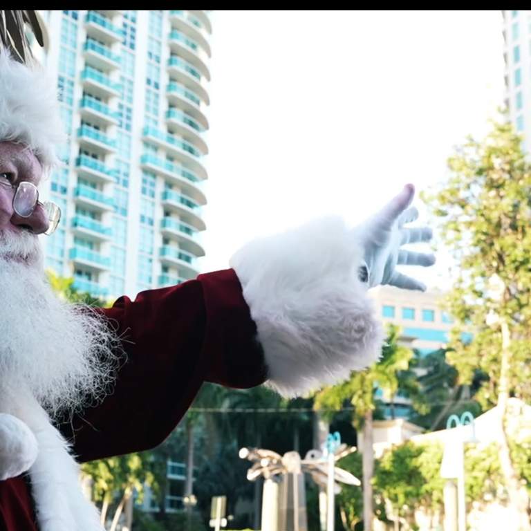 Santa waving from a Cruisin' Tiki on the New River in Fort Lauderdale
