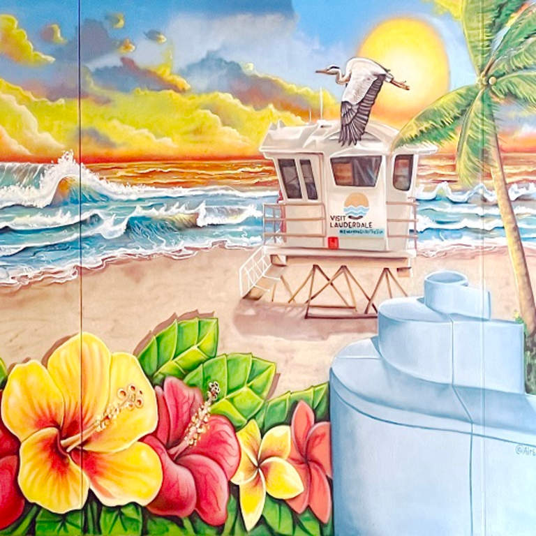 Photo of mural depicting the face of mother nature gazing onto Fort Lauderdale Beach.
