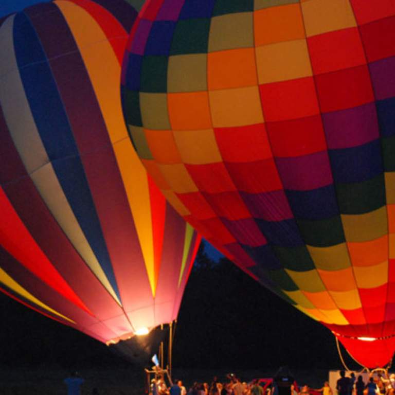 Hot air balloons taking off at the Allen County Fair.
