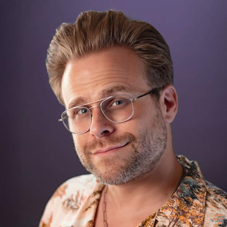 Promotional photo of Adam Conover from his website. He will be performing in Fort Wayne at Summit City Comedy Club on January 15, 16, and 17, 2026.