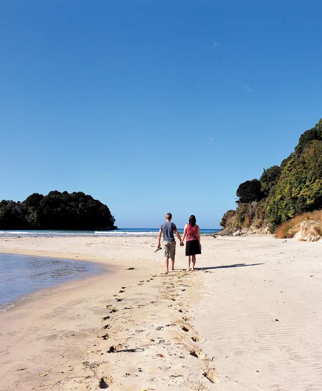 Couple walking on the beach, Bathing Beach - Stewart Island