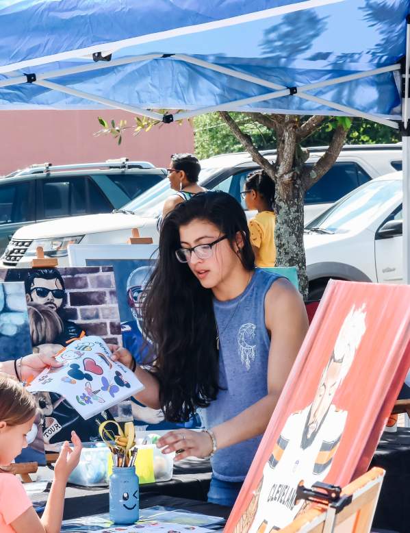 Beaumont Artisan selling wares at street fair