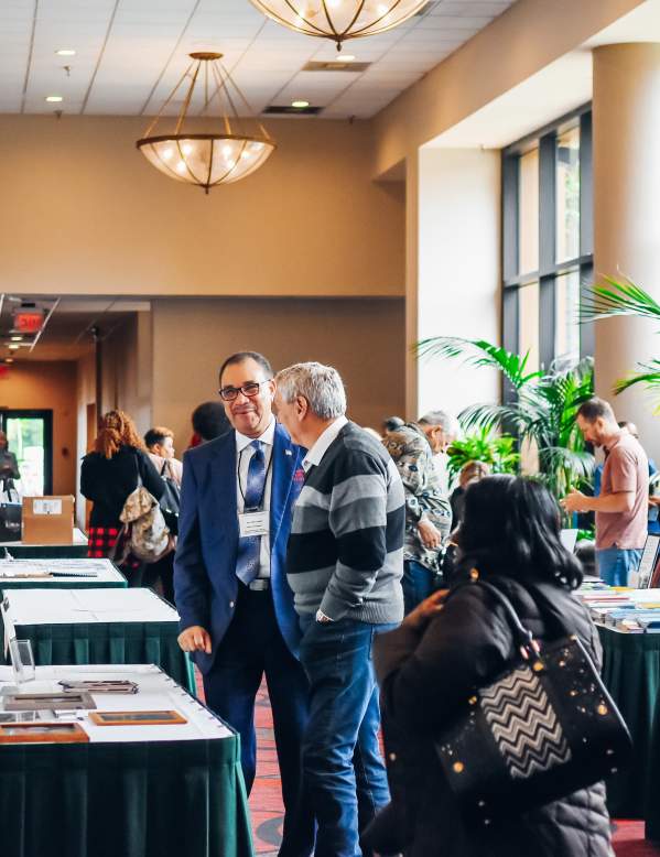Vendor booths and attendees at a confernece