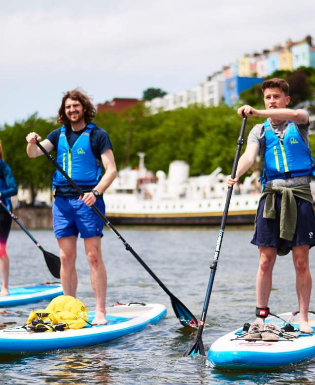 Group on paddelboards in Bristol harbour - credit SUP Bristol