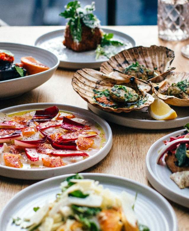 Selection of small plates on a table at Bristol Lido