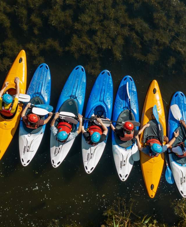 A group of people kayaking at Mendip Activity Centre, near Bristol - credit Mendip Activity Centre