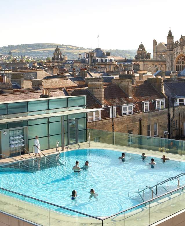 An aerial view of the rooftop pool at the Thermae Bath Spa in central Bath near Bristol, with Bath's skyline in the background
