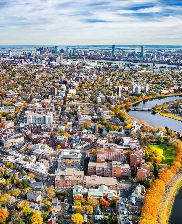 An aerial shot of Boston from Harvard Square with the trees changing in fall.