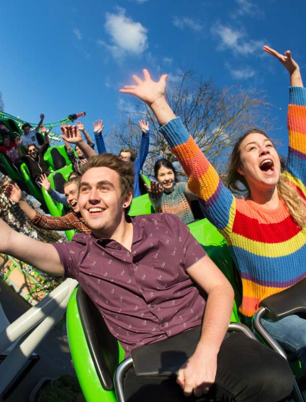Drayton Manor Resort Theme Park Thrills arms in the air on Accelerator rollercoaster