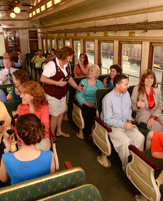 People Drinking Wine On A Train