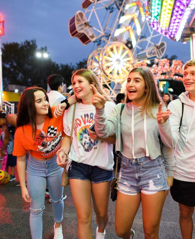group of teenagers enjoying a carnival
