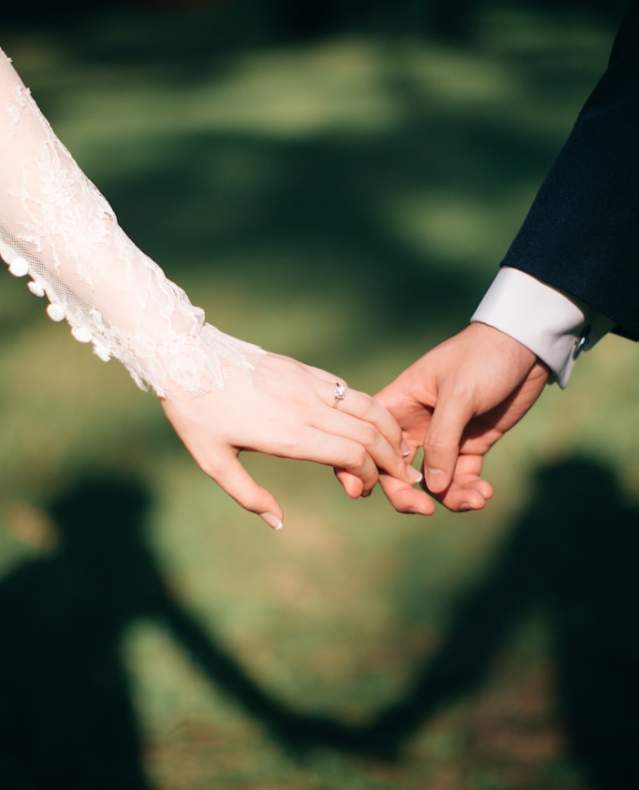 wedding couple holding hands