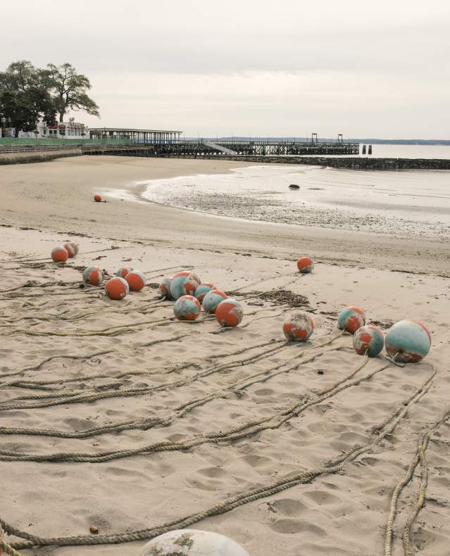 A quiet Playland Beach is shown with the lines for swimming lanes laid out on the sand.