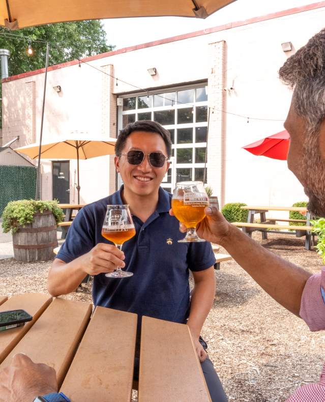 Broken Brewery Toast with two guests in beer garden