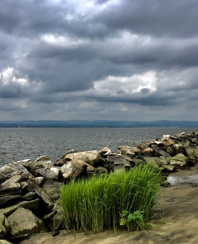 Storm clouds gather over Croton Point Park in summer.