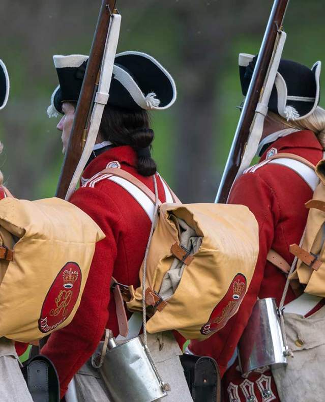 revolutionary war reenactment soldiers in a line