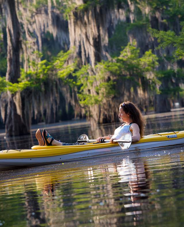 Canoeing on lake along Boom or Bust Byway in northwest Louisiana