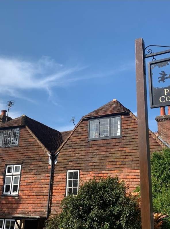 Pooh Corner sign, showing Winnie the Pooh and piglet
