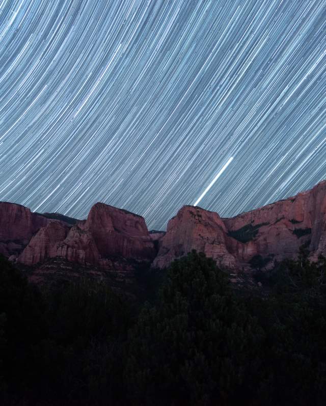 Dark sky views in Kolob Canyons above the vibrant red rock cliffs.