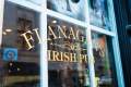Close up of window reading "Flanagan's Irish Pub"