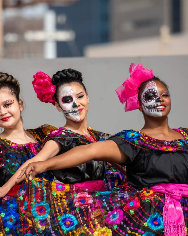 Three dancers at Festival de Vida y Muerte in Scissortail Park