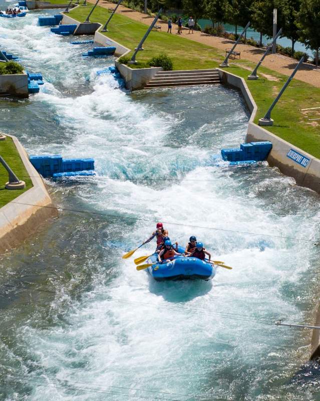 Group riding the water rapids at RIVERSPORT