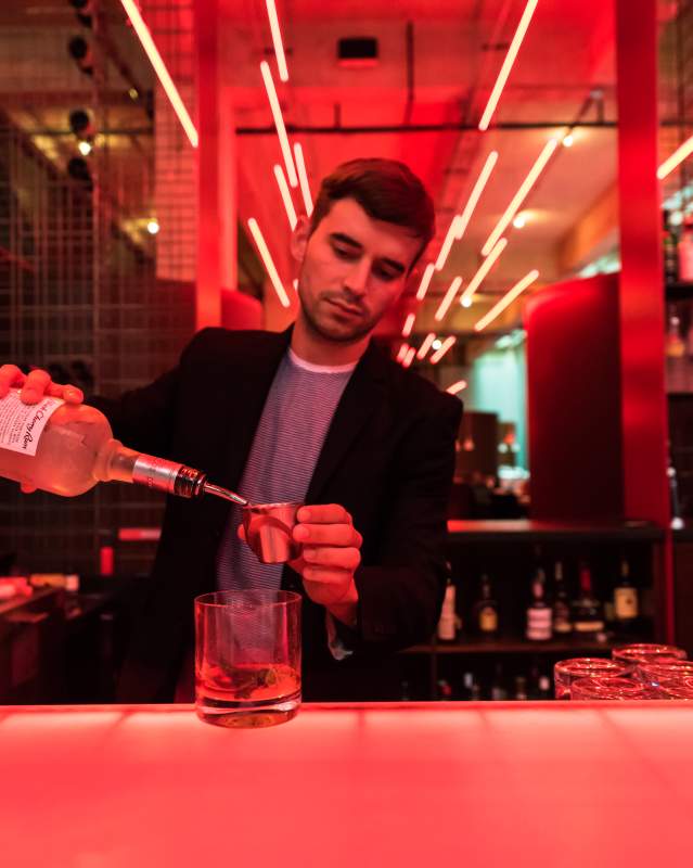 Bartender pouring cocktail drink at Oklahoma City's Red Primesteak