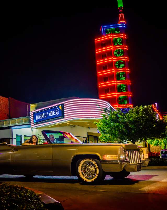 Couple driving along Route 66 in Western Avenue District.