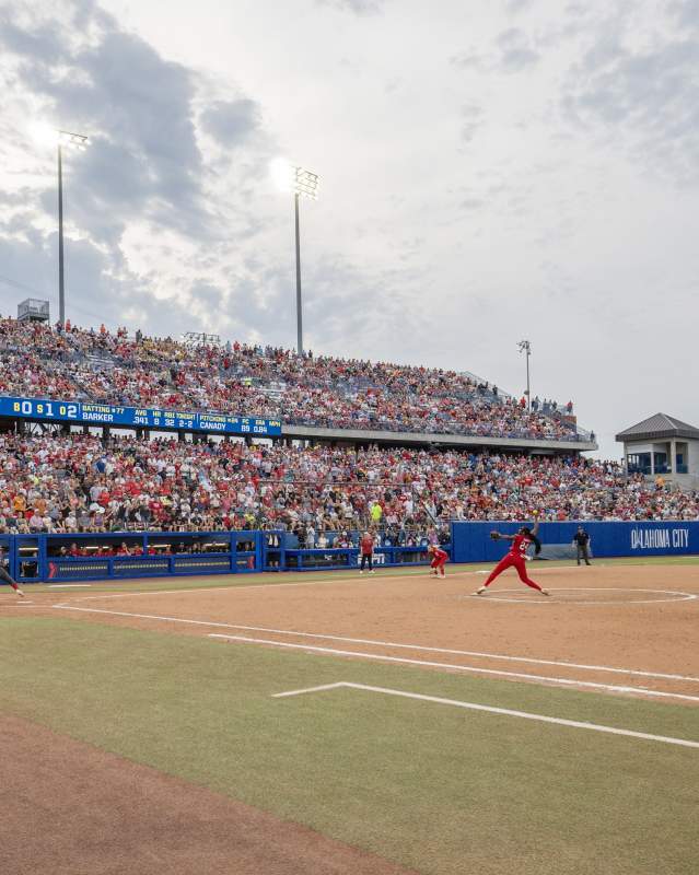 Women playing softball at Women's College World Series at Devon Park