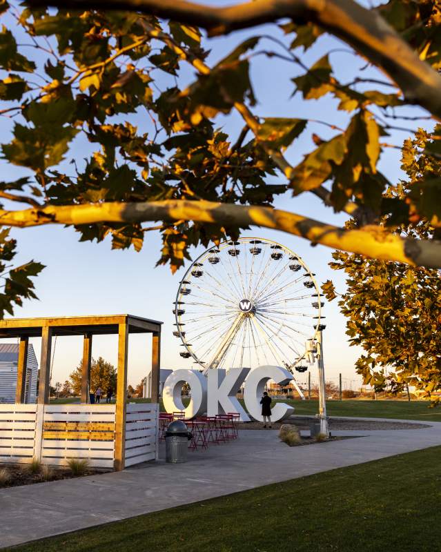 Fall leaves in the Wheeler District, in the background is an OKC sign and the Wheeler Ferris Wheel