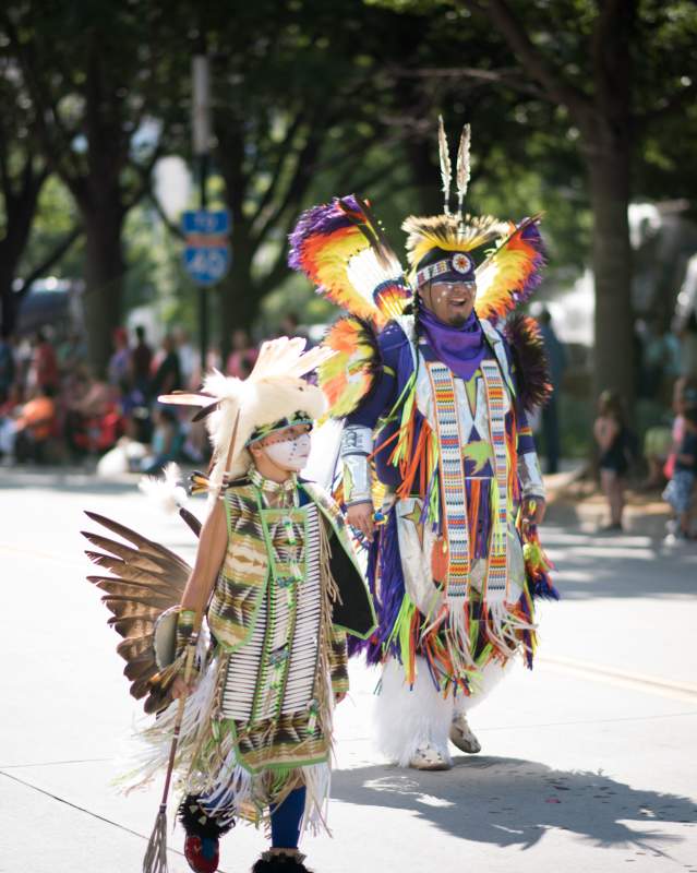 Native American Man And Boy In Traditional Clothing